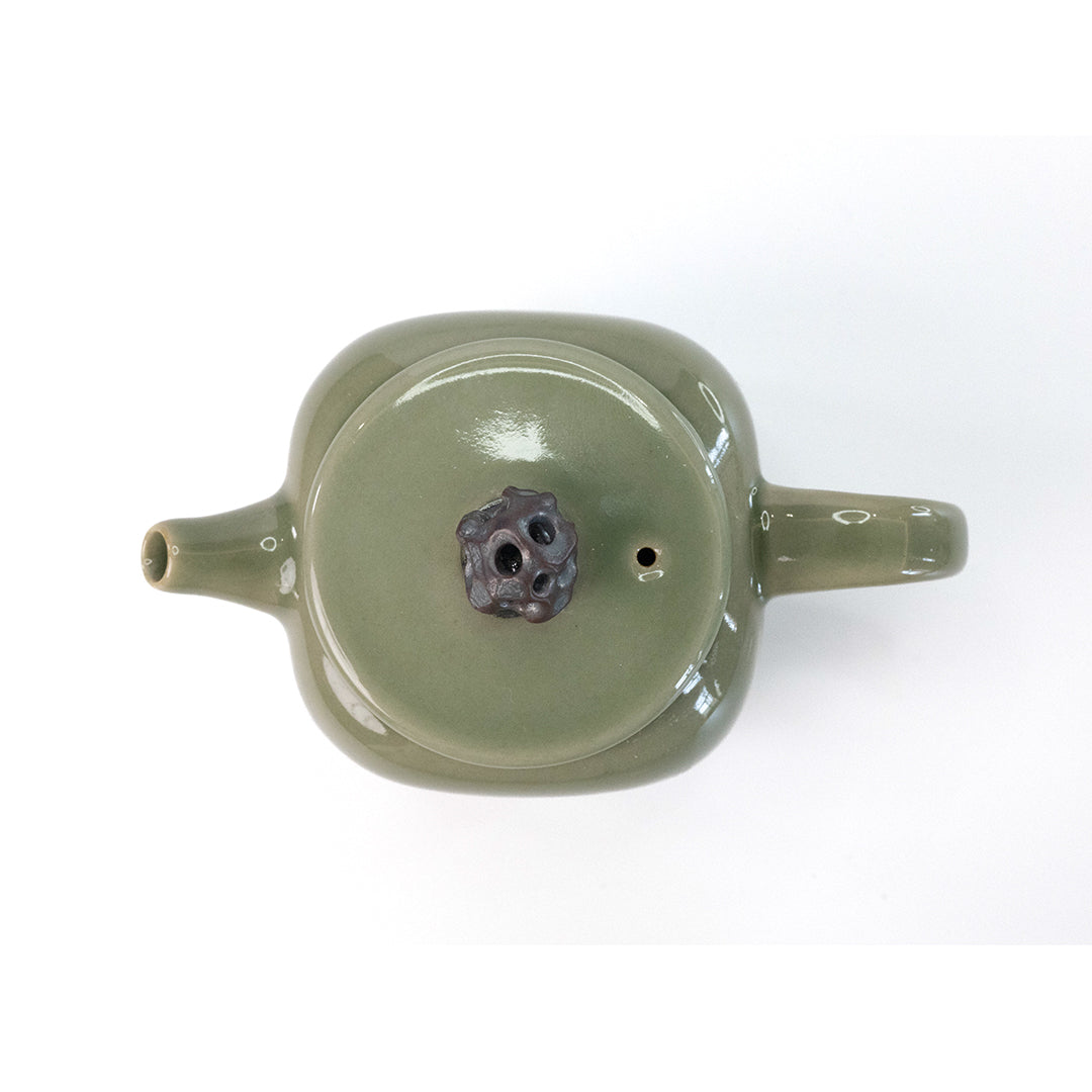 Celadon Teapot with Combined Relief and Incised Carving