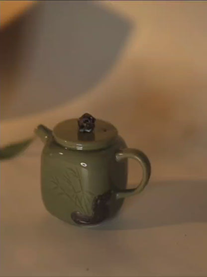 Celadon Teapot with Combined Relief and Incised Carving